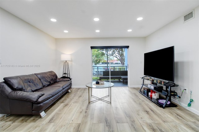 living room with light hardwood / wood-style floors