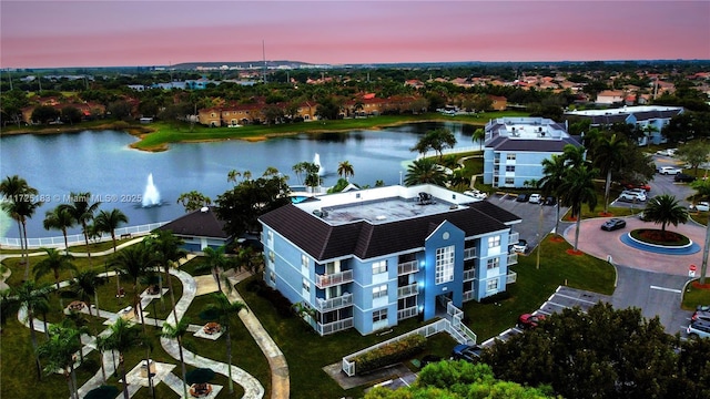 aerial view at dusk with a water view