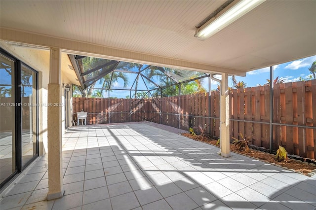 view of patio / terrace featuring glass enclosure