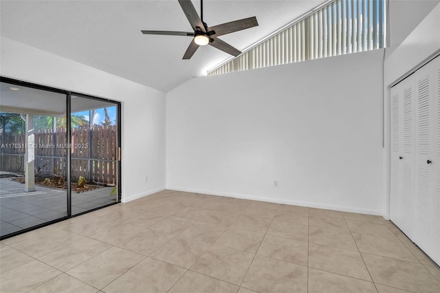 interior space with high vaulted ceiling, light tile patterned flooring, and ceiling fan