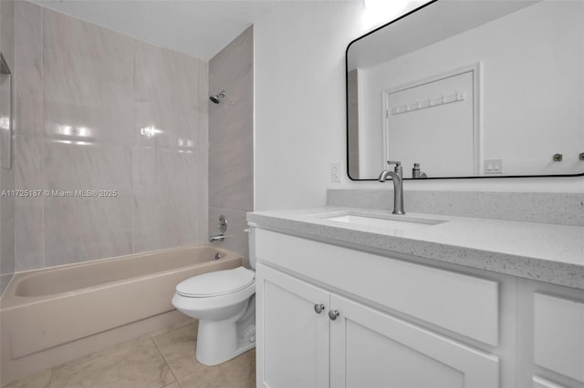 full bathroom featuring vanity, tile patterned floors, tiled shower / bath combo, and toilet