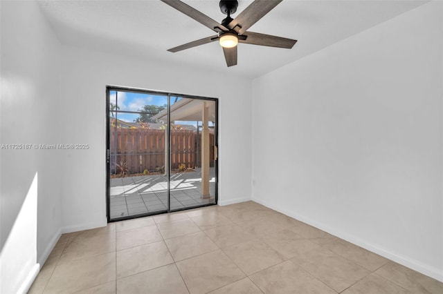 empty room featuring ceiling fan and light tile patterned flooring