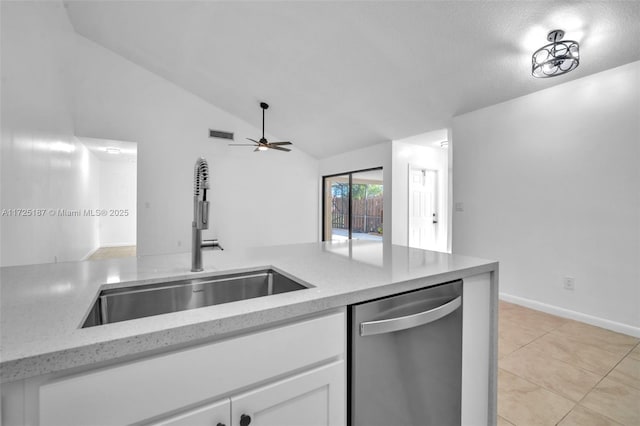 kitchen featuring dishwasher, lofted ceiling, white cabinetry, ceiling fan, and sink