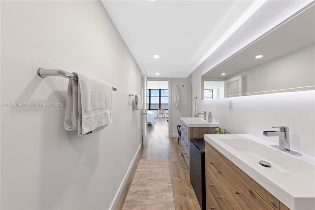 bathroom with vanity and hardwood / wood-style flooring