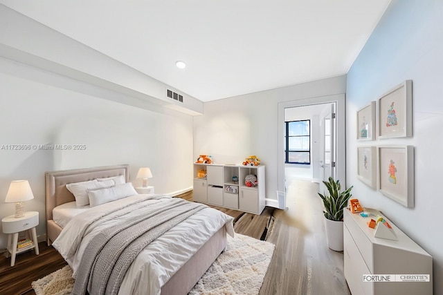 bedroom featuring dark hardwood / wood-style flooring