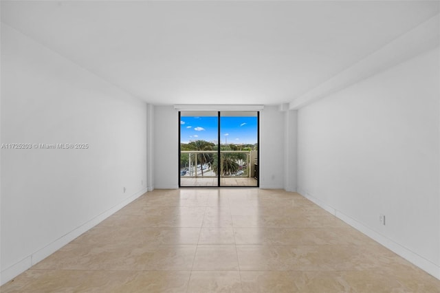 tiled empty room with floor to ceiling windows