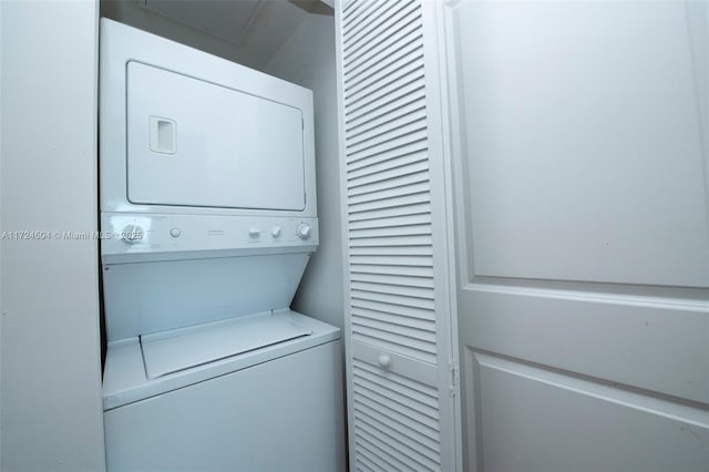 laundry area featuring stacked washer and clothes dryer