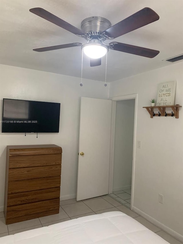 unfurnished bedroom featuring ceiling fan and light tile patterned floors