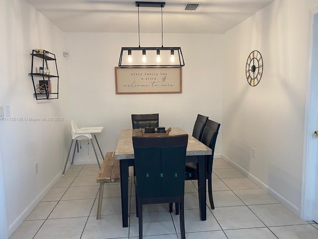 dining space with light tile patterned floors