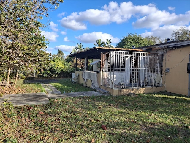 view of home's exterior with a yard