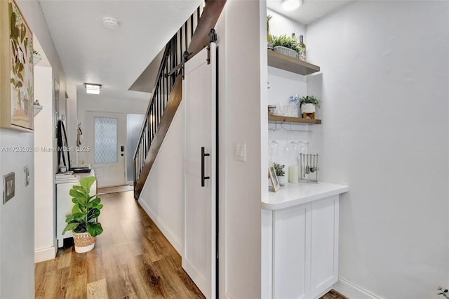 hallway with light wood-type flooring