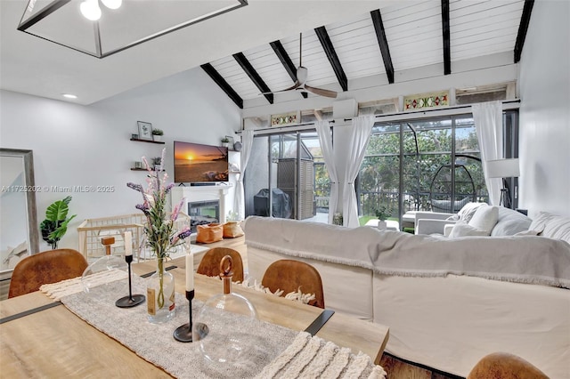 living room with wood-type flooring, ceiling fan, vaulted ceiling with beams, and wood ceiling