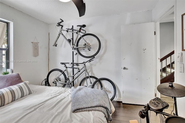 bedroom with dark wood-type flooring