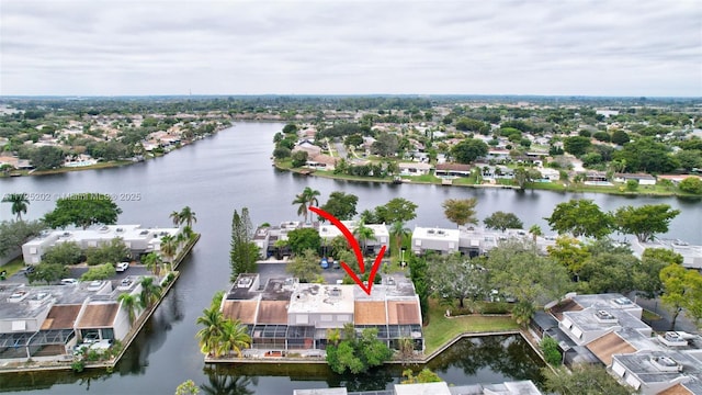 birds eye view of property featuring a water view