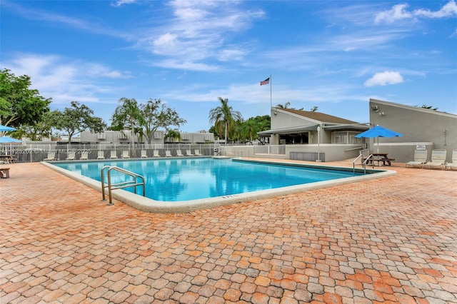 view of swimming pool with a patio area