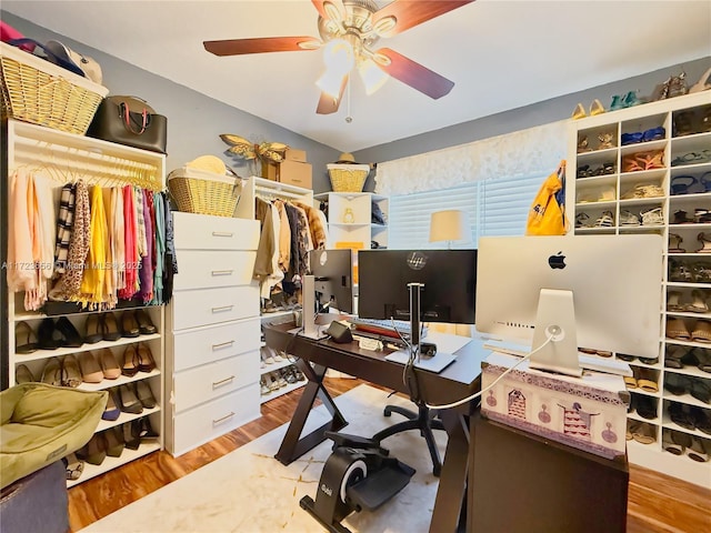 home office with ceiling fan and hardwood / wood-style flooring