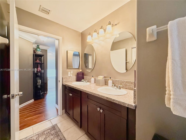 bathroom with tile patterned floors and vanity