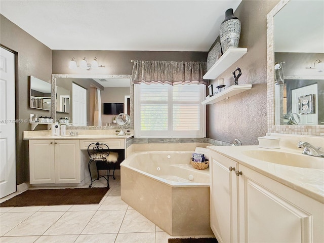 bathroom with a bathtub, tile patterned floors, and vanity