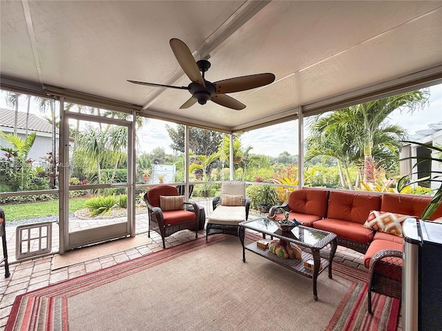 sunroom featuring ceiling fan and a healthy amount of sunlight