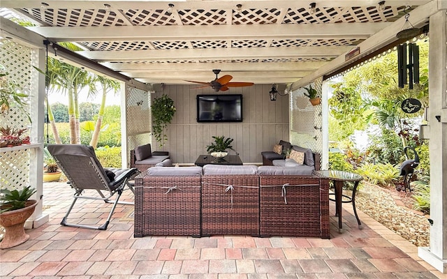 view of patio / terrace featuring ceiling fan and an outdoor living space