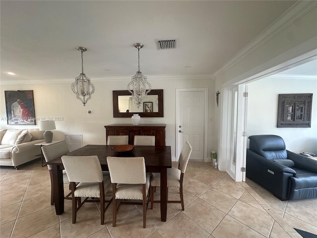 dining area featuring ornamental molding, light tile patterned flooring, and a notable chandelier