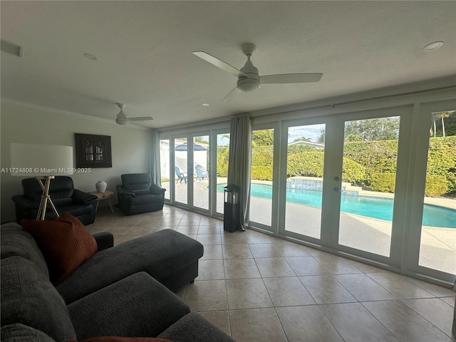 living room with ceiling fan and french doors