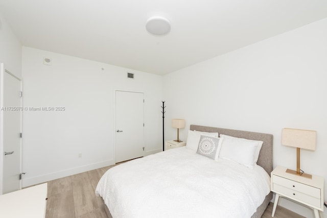 bedroom with light wood-type flooring