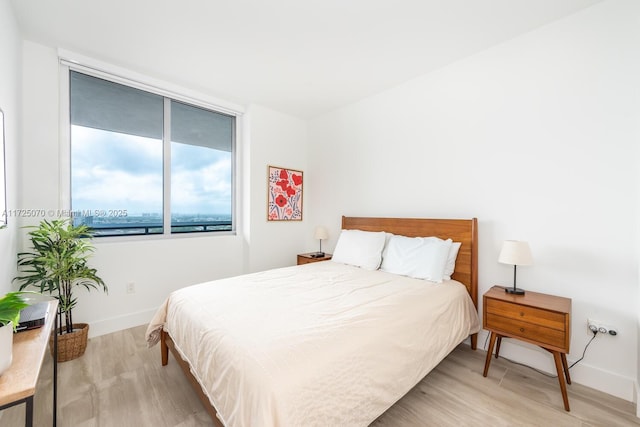 bedroom with light hardwood / wood-style flooring