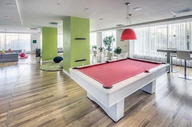 game room with visible vents, billiards, baseboards, and wood finished floors