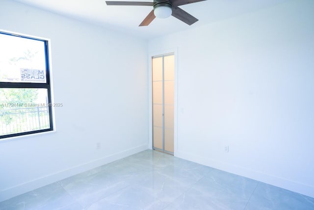 empty room featuring ceiling fan