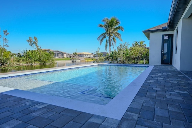 view of pool with a water view