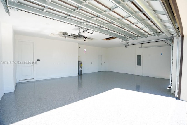 garage featuring electric panel, a garage door opener, and water heater