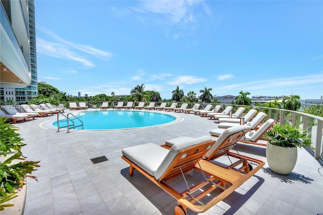 view of swimming pool with a patio area