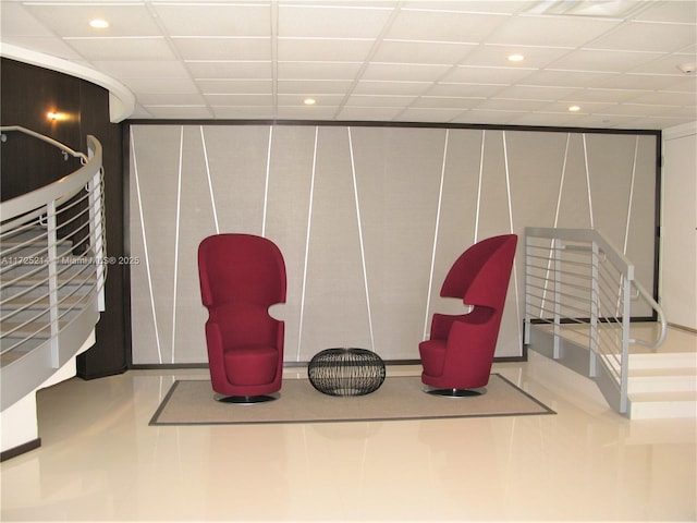 sitting room with a paneled ceiling