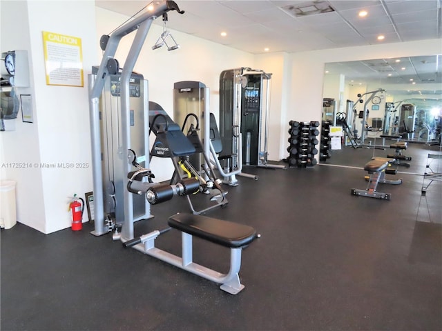 gym featuring a paneled ceiling