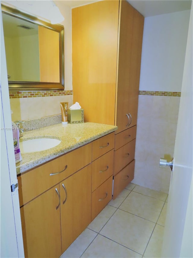 bathroom featuring tile walls, vanity, and tile patterned floors