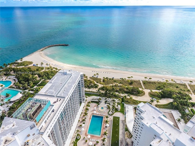 bird's eye view featuring a beach view and a water view