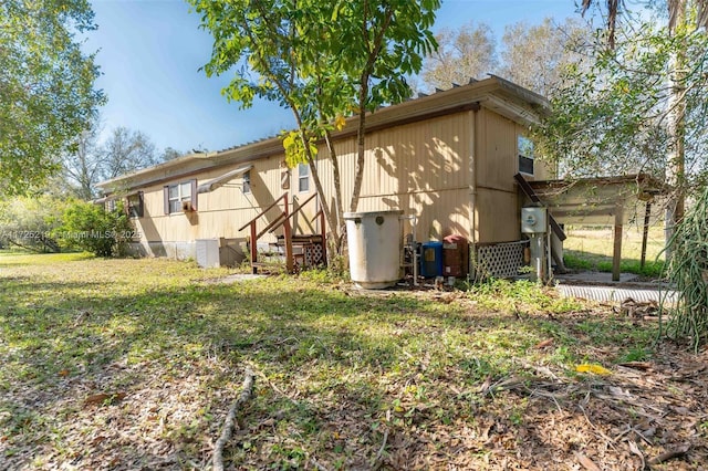 view of property exterior featuring a yard