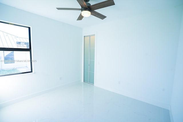 unfurnished room featuring concrete floors and ceiling fan