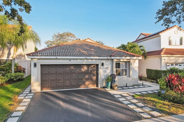 mediterranean / spanish-style house featuring a garage