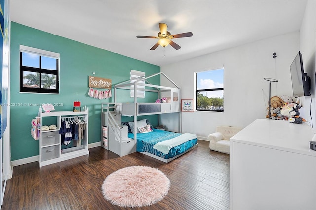 bedroom featuring ceiling fan and dark hardwood / wood-style floors