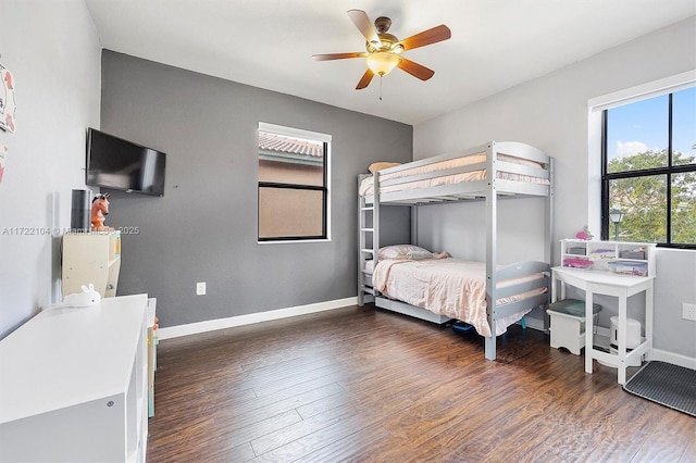 bedroom featuring ceiling fan and dark hardwood / wood-style floors