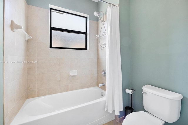 bathroom featuring shower / bathtub combination with curtain and toilet