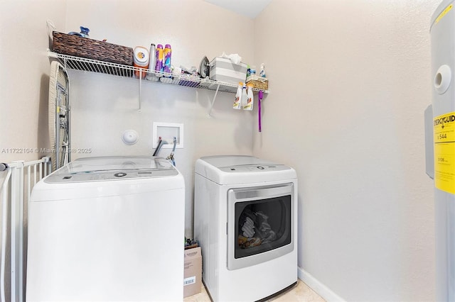 clothes washing area featuring independent washer and dryer