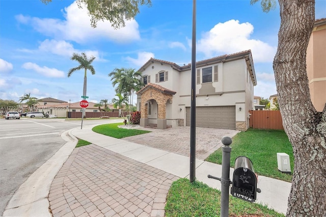 mediterranean / spanish-style home featuring a garage