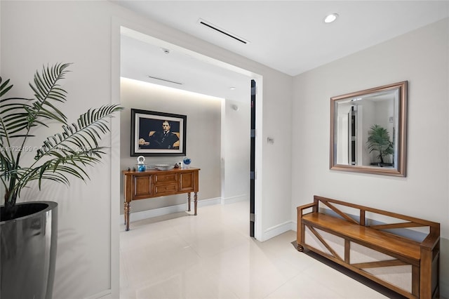 hallway featuring light tile patterned flooring