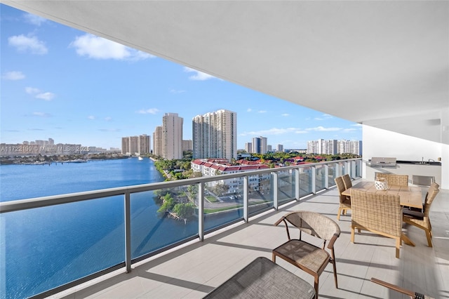 balcony featuring a water view