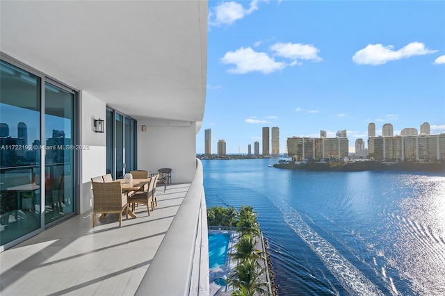 balcony featuring a water view