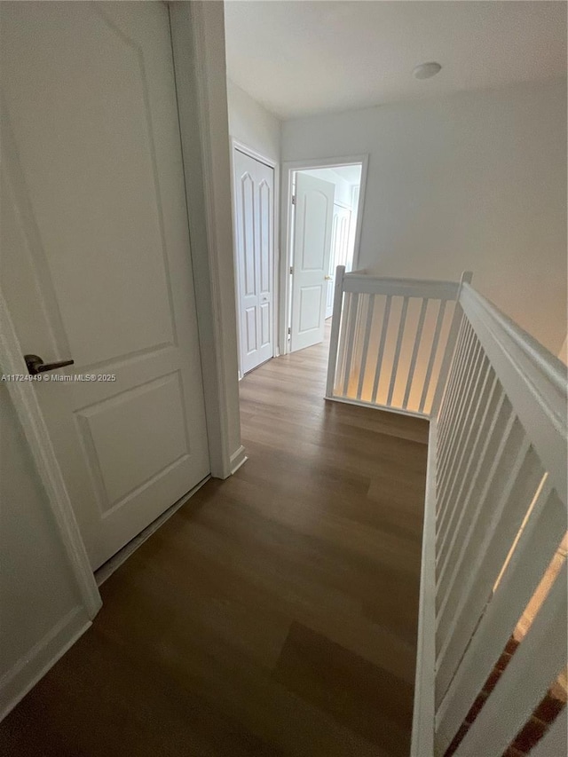 corridor featuring hardwood / wood-style floors