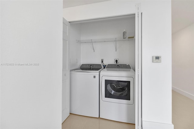 washroom featuring washing machine and dryer